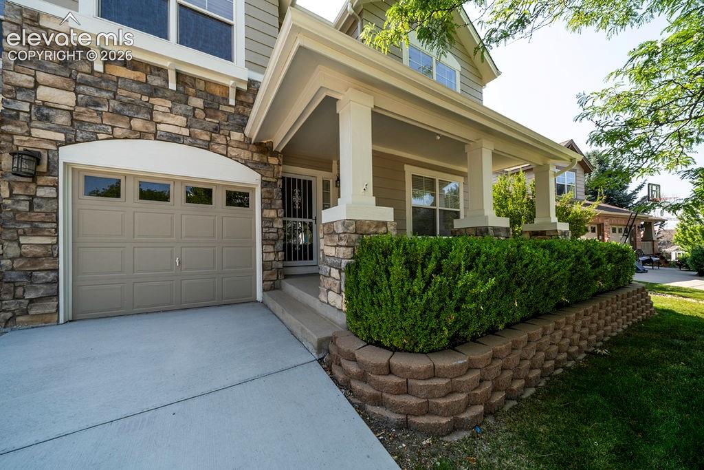 Image 4 of 50: Walk up the front steps to a private, spacious front porch