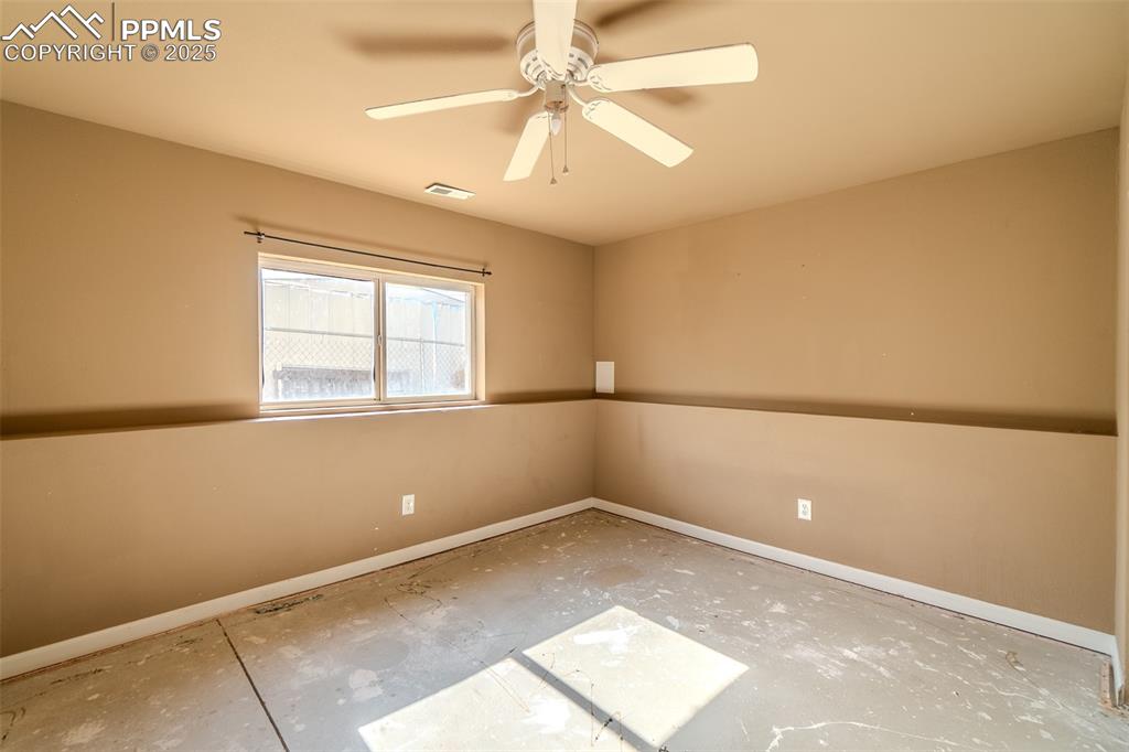 Image 16 of 36: Empty room featuring baseboards and ceiling fan