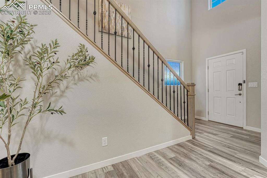 Image 3 of 50: Foyer with luxury vinly finished floors and high ceiling design
