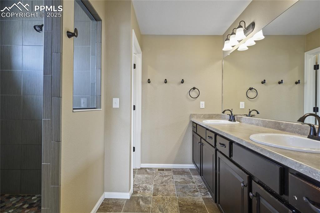 Image 21 of 38: Bathroom featuring vanity