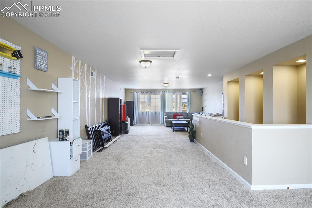 Image 33 of 38: View of carpeted living room