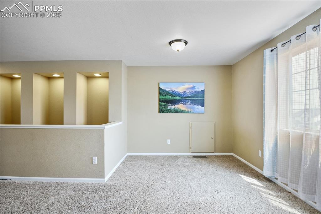 Image 34 of 38: View of carpeted empty room