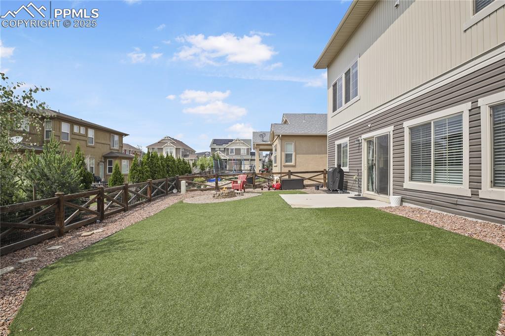 Image 5 of 38: View of yard with a patio area