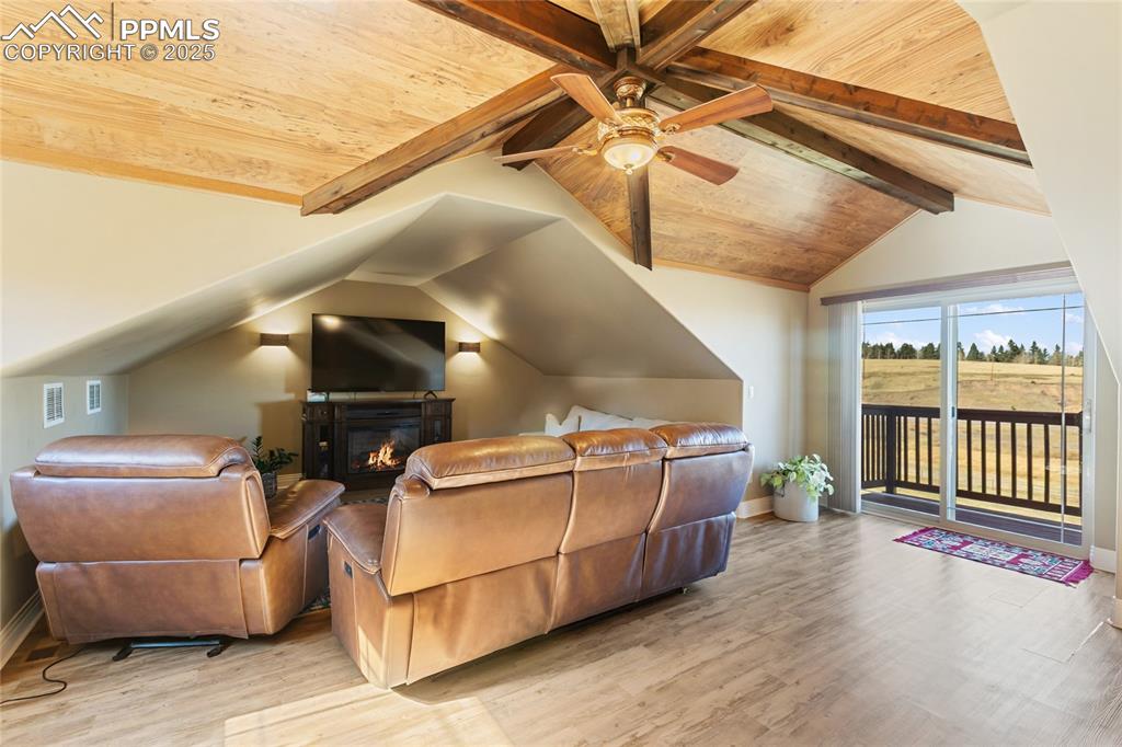 Image 10 of 31: Its the perfect family room and even has a walk out and balcony!