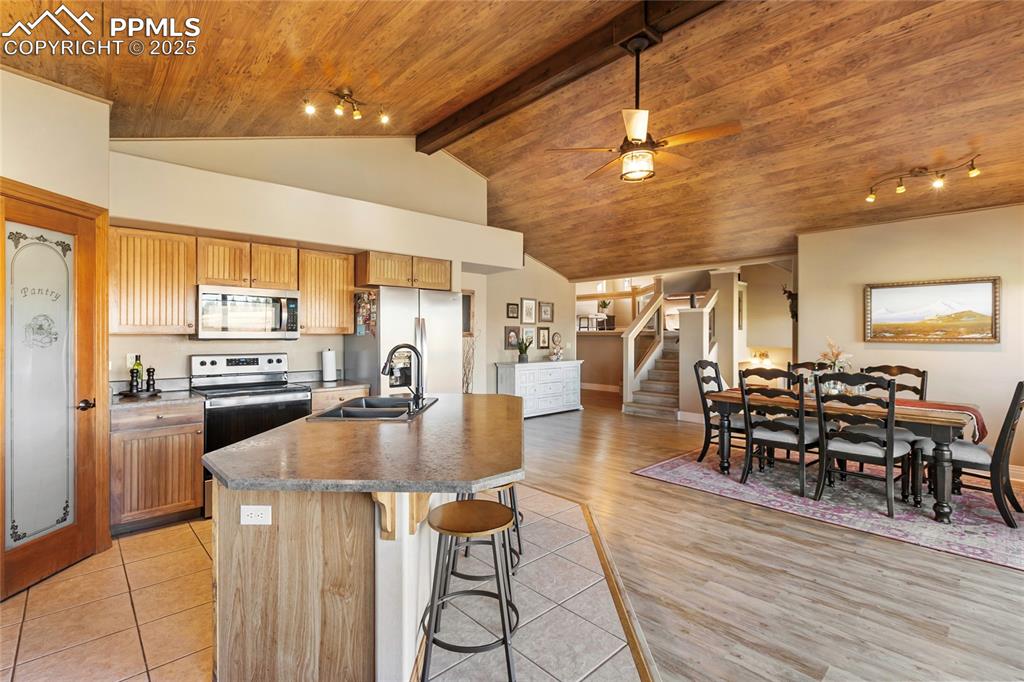 Image 15 of 31: The hickory cabinets and stainless appliances really add to the rustic, mou