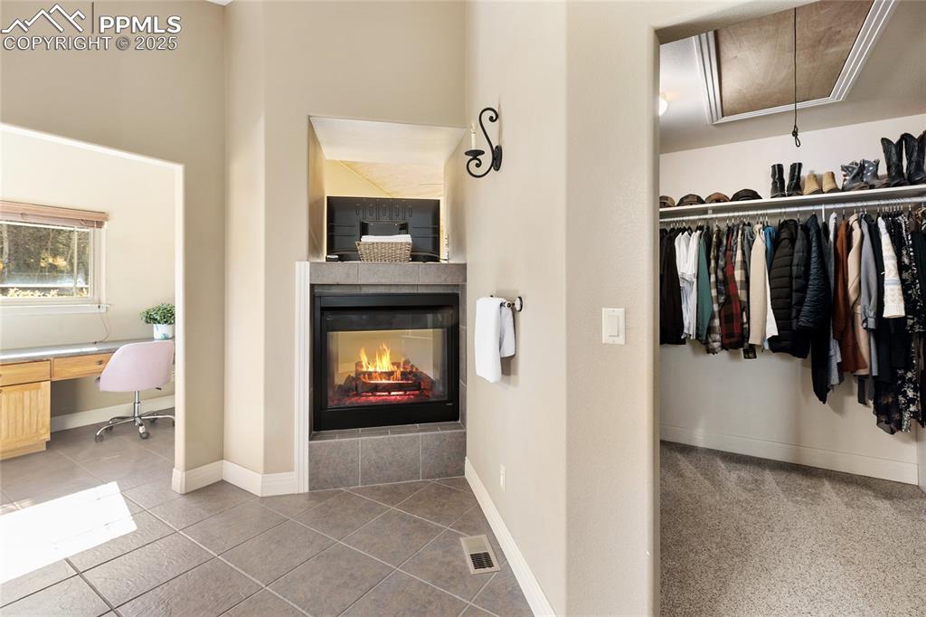 Image 20 of 31: Plus a walk in closet and a dual sided gas fireplace.