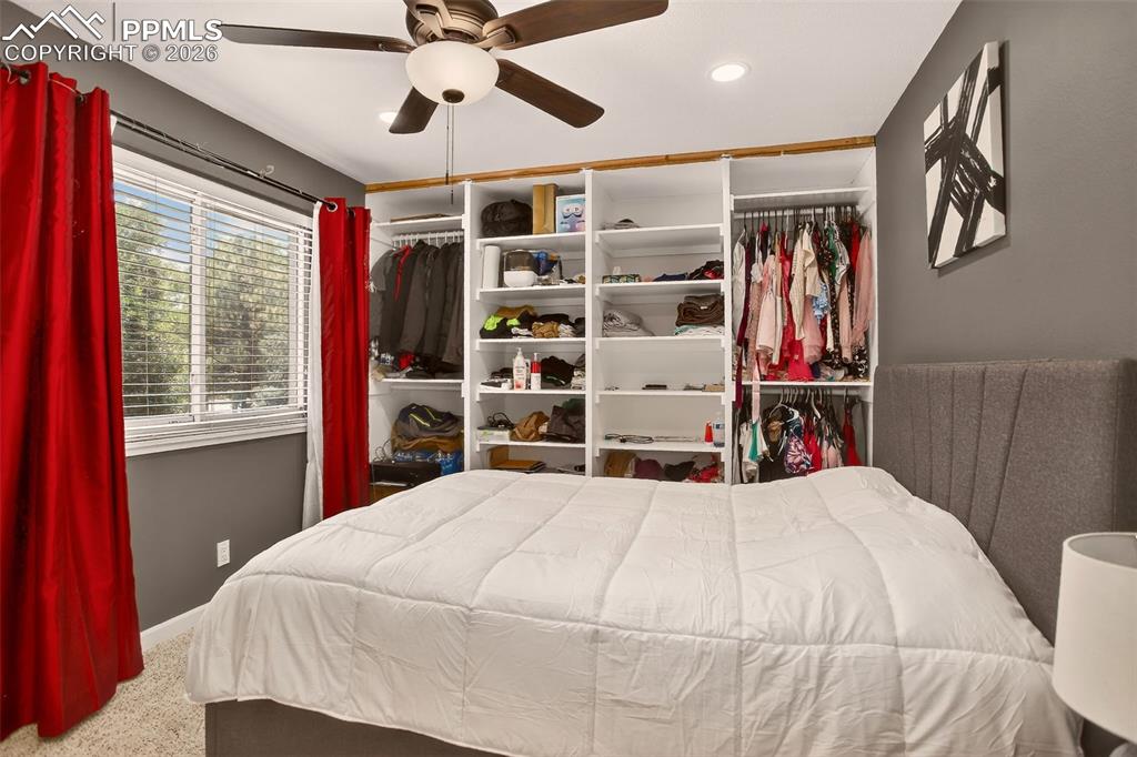 Image 10 of 22: "The primary bedroom features an en-suite bathroom, built-in shelving, fres