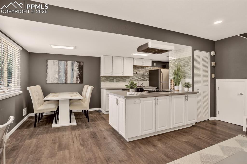 Image 2 of 22: "Updated and move-in ready end unit in a Pool Community. New Luxury Vinyl f