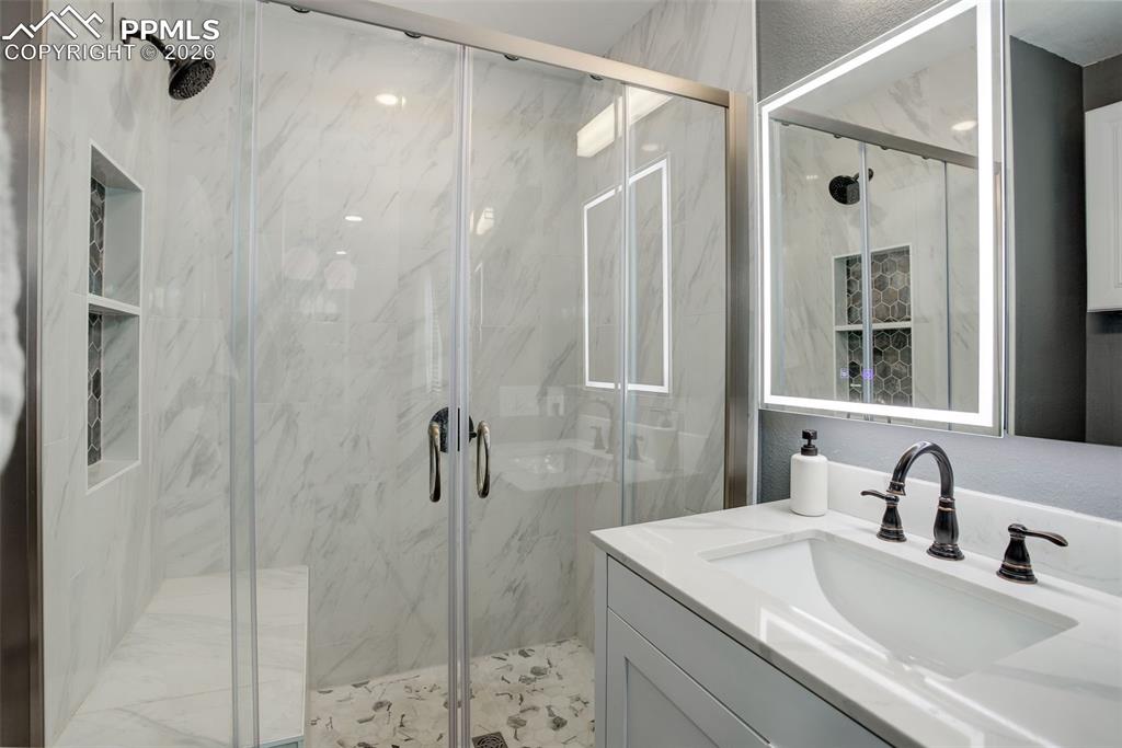 Image 3 of 22: "Step into the elegance of the newly designed primary en-suite bathroom, sh