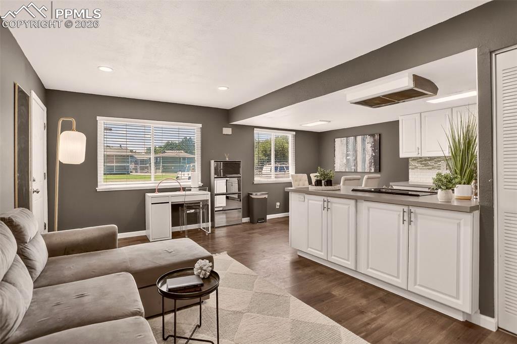 Image 8 of 22: "Updated and move-in ready end unit in a Pool Community. New Luxury Vinyl f