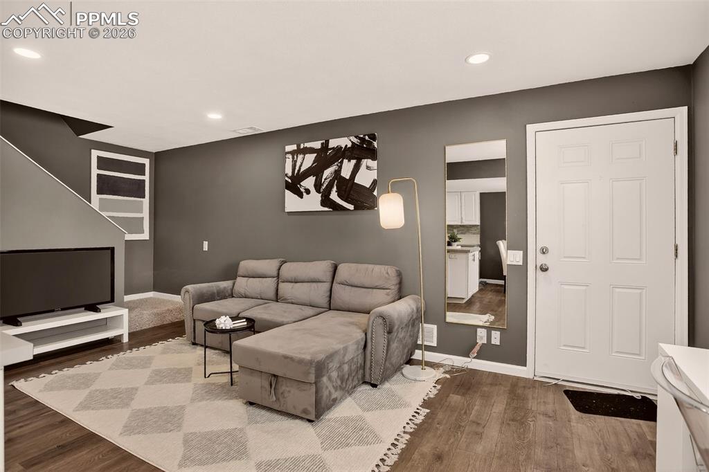 Image 9 of 22: "Updated and move-in ready end unit in a Pool Community. New Luxury Vinyl f