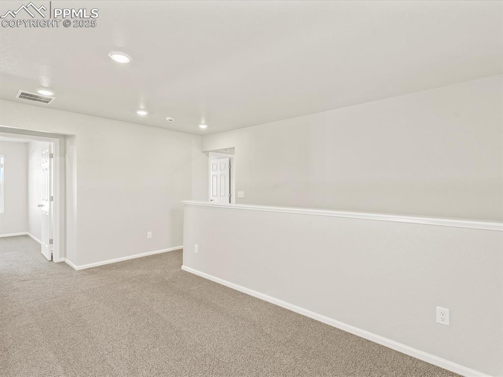 Image 18 of 26: Carpeted empty room featuring baseboards and recessed lighting