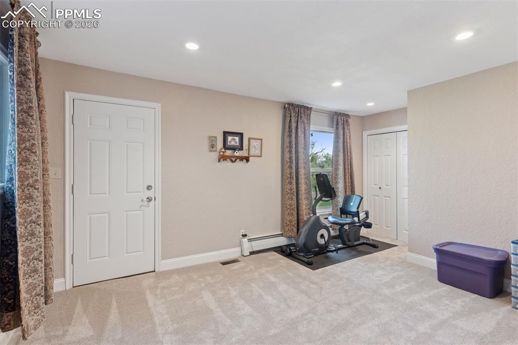 Image 15 of 50: Potential second primary or bonus room with attached bath and access to ext