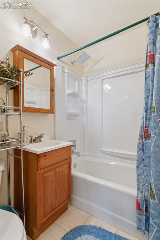 Image 16 of 50: Attached full bath to second primary