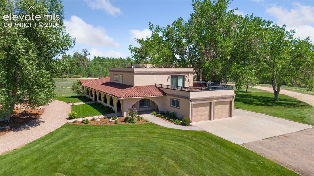 Image 2 of 50: Spanish-Inspired Main Residence on 35 Acres