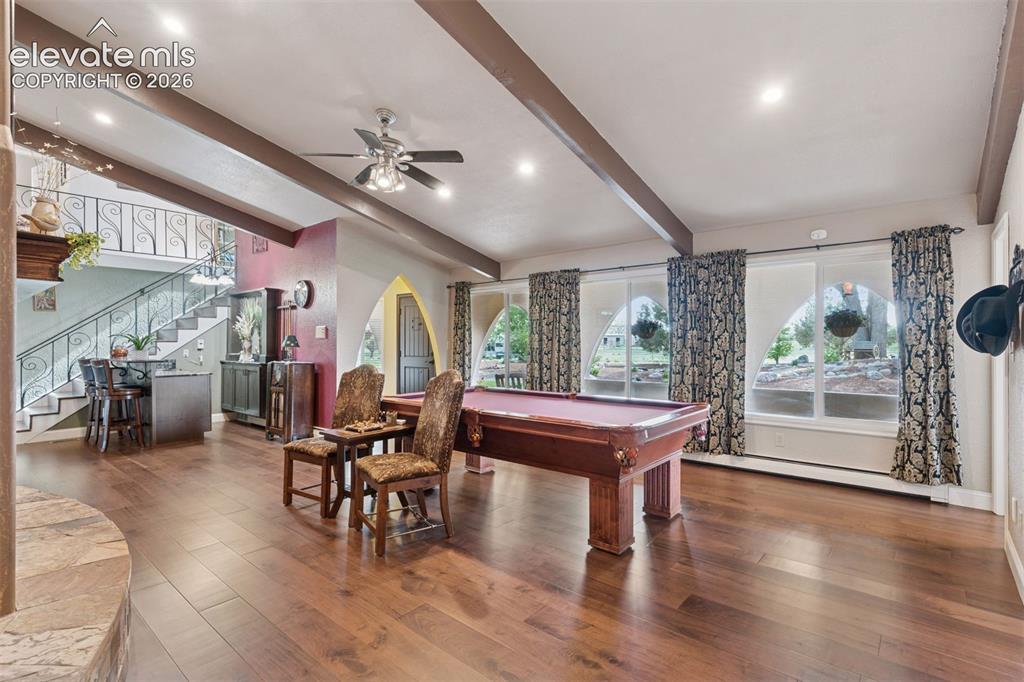 Image 27 of 50: Alternate view of Family room with covered front porch through windows