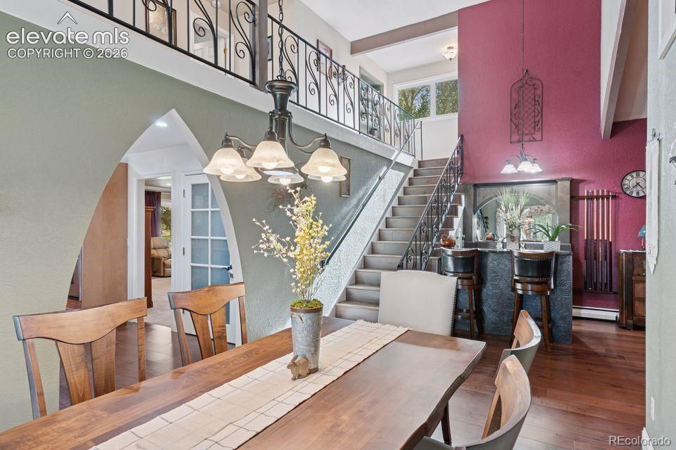 Image 29 of 50: Dining Area with Wet Bar & Custom Architectural Details