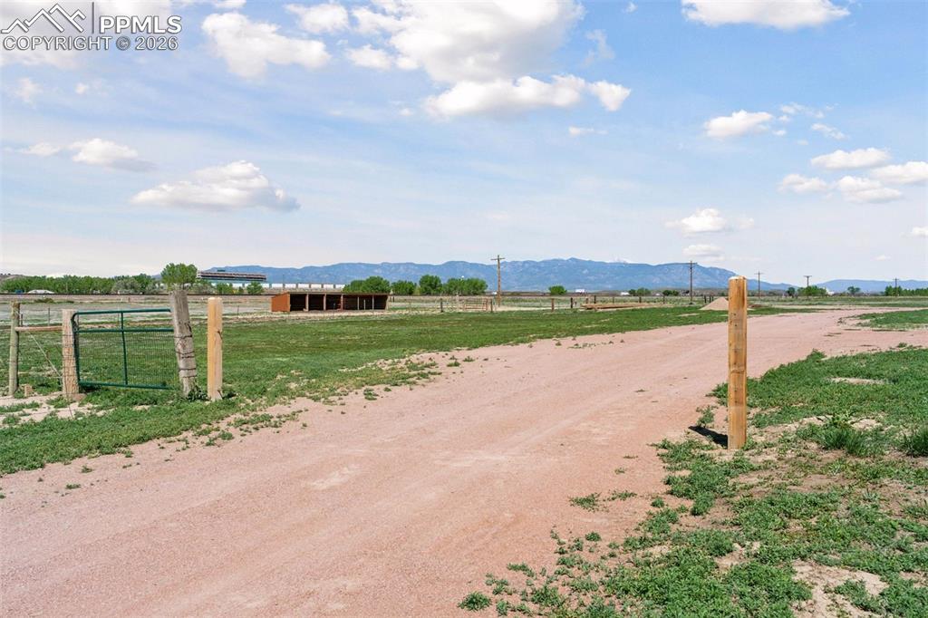 Image 43 of 50: View of dirt / gravel road featuring a view of rural / pastoral area and a 
