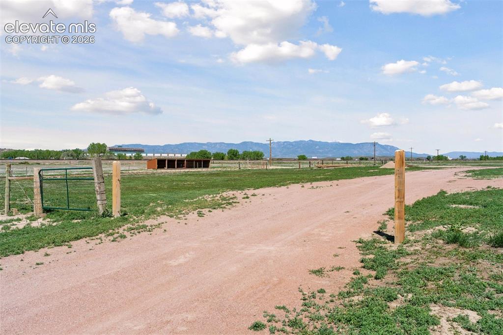 Image 6 of 50: Ranch Approach with Pasture & Front Range Views