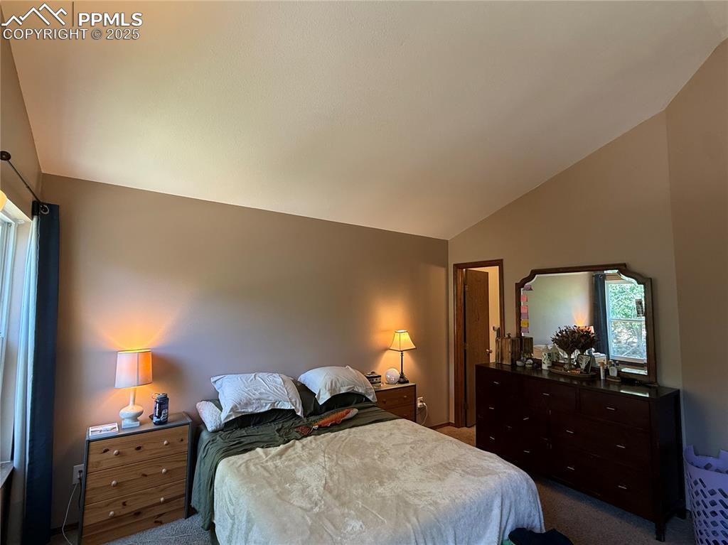 Image 11 of 17: Master bedroom with attached full bath.