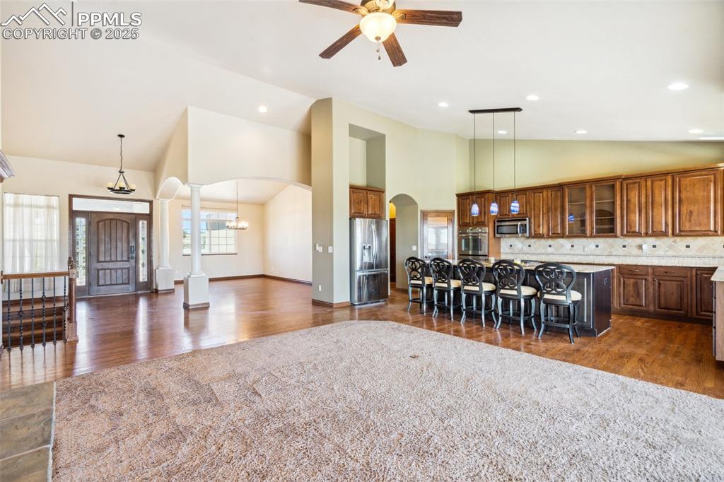 Image 11 of 50: Vaulted ceilings, arched doorways, pillars, wrought iron rails, solid wood 