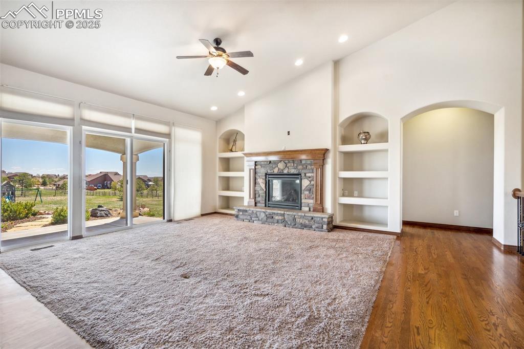 Image 8 of 50: Living room walks out to 24x20 covered patio.
