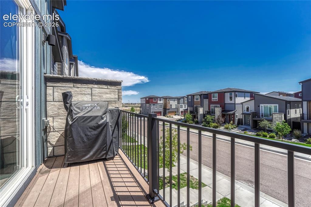 Image 8 of 30: Composite material deck with metal railing.