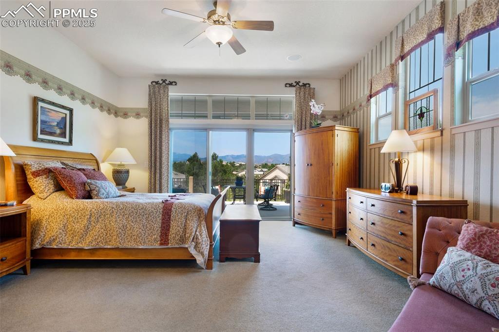 Image 3 of 41: Glass doors lead to the deck and showcase the mountain views