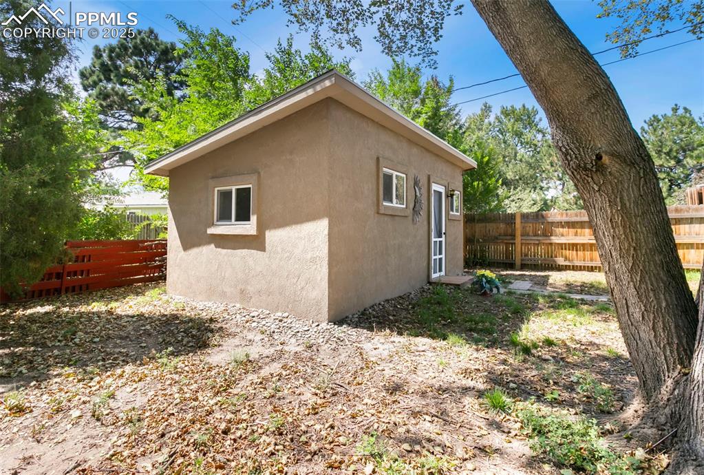 Image 20 of 23: View of property exterior with stucco siding