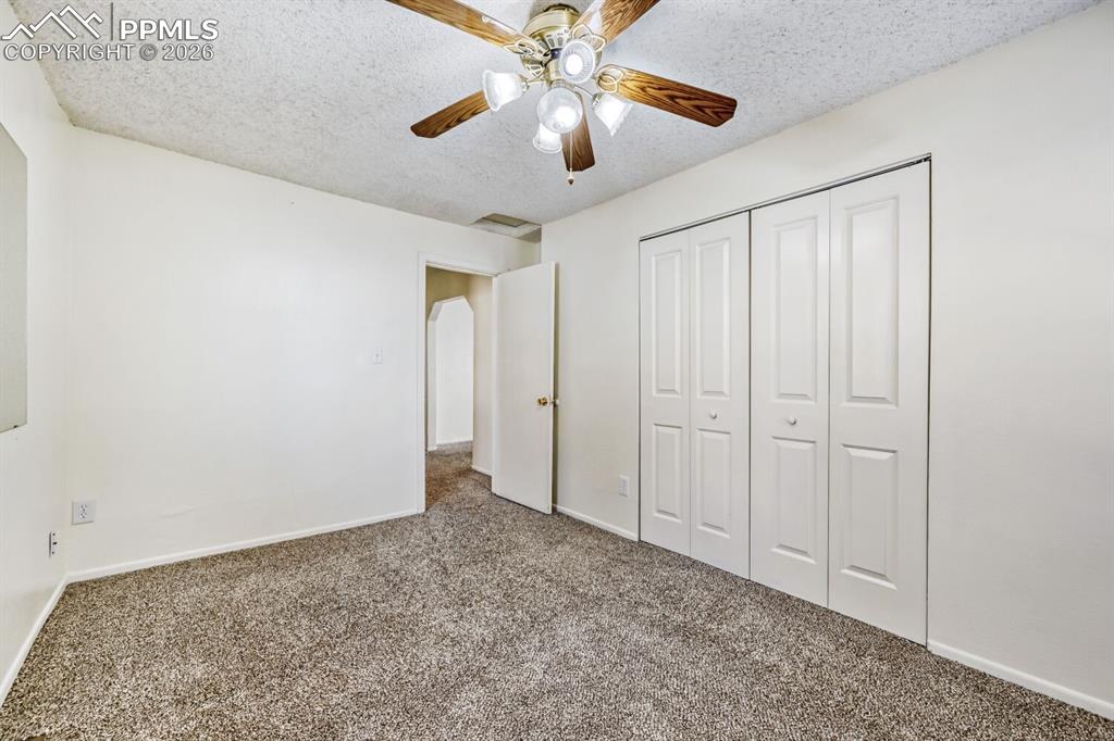 Image 19 of 30: Master bedroom with ceiling fan