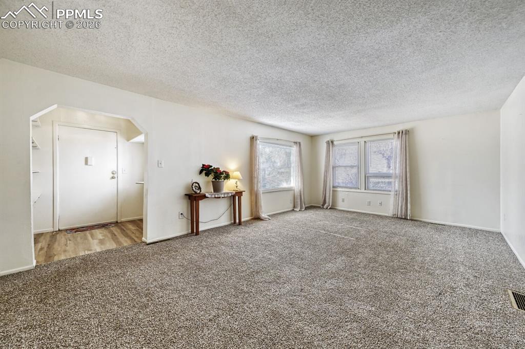 Image 5 of 30: Entry way and living area