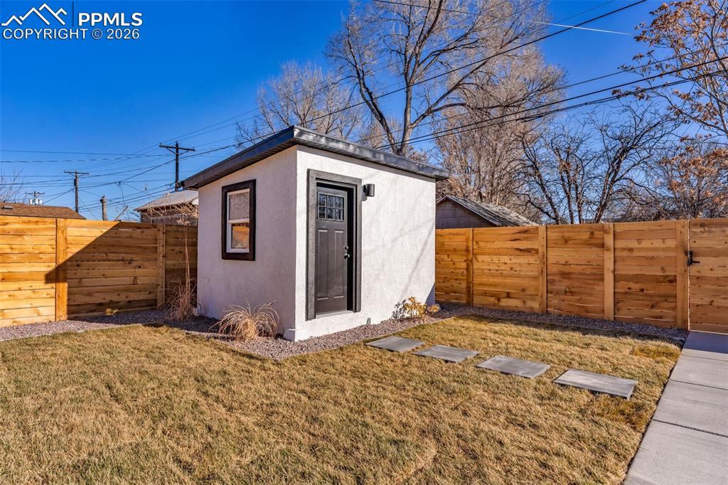 Image 26 of 39: View of outbuilding with a fenced backyard