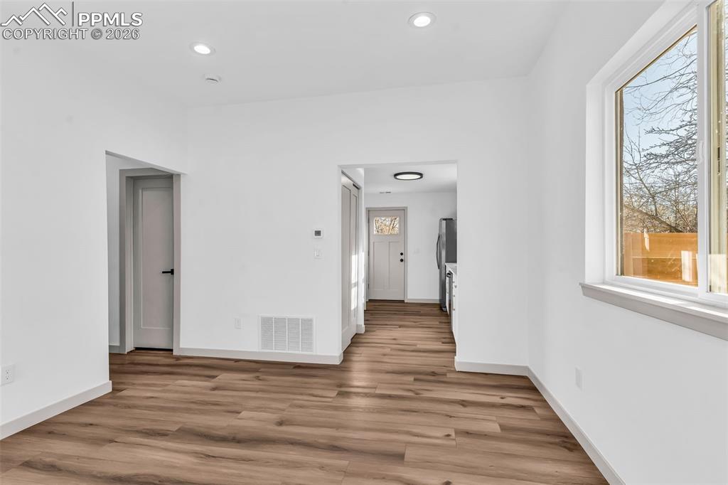 Image 6 of 39: LIVING ROOM Featuring light wood-style looring and recessed lighting