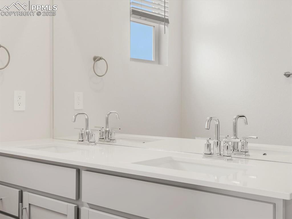 Image 28 of 40: Full bathroom with double vanity