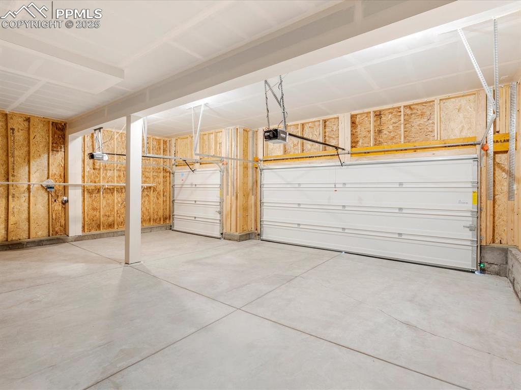 Image 40 of 40: Garage with a garage door opener