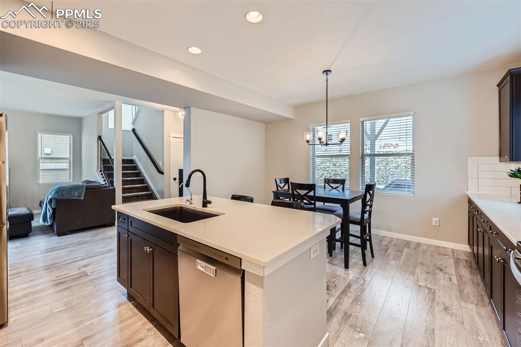 Image 13 of 46: Stainless steel appliances, quartz countertops, pantry, island, gourmet kit