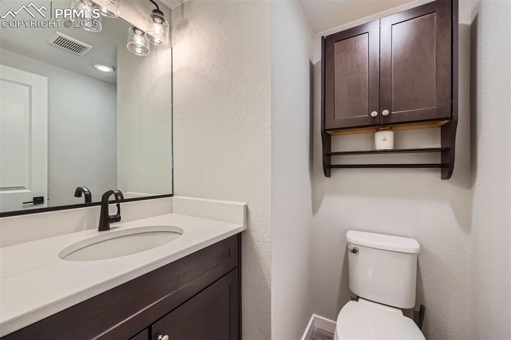 Image 15 of 46: Half bath on main level.