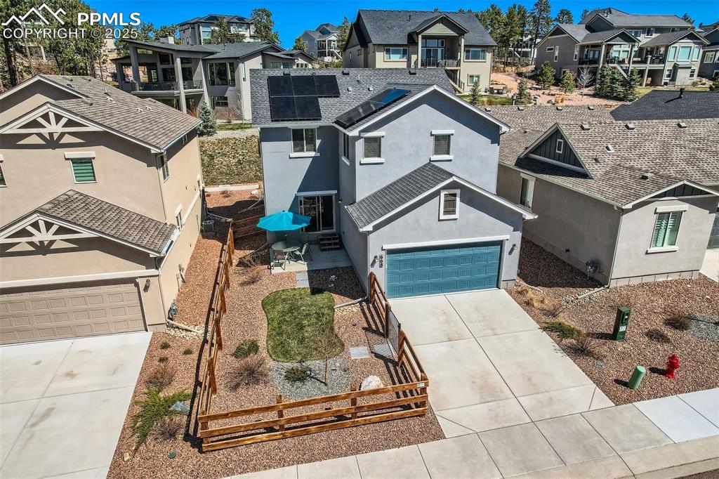 Image 42 of 46: Back of home, fenced back yard.