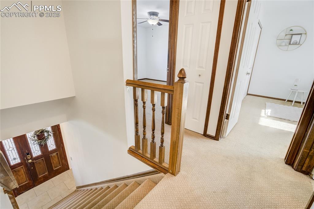 Image 23 of 50: Staircase leading to upstairs