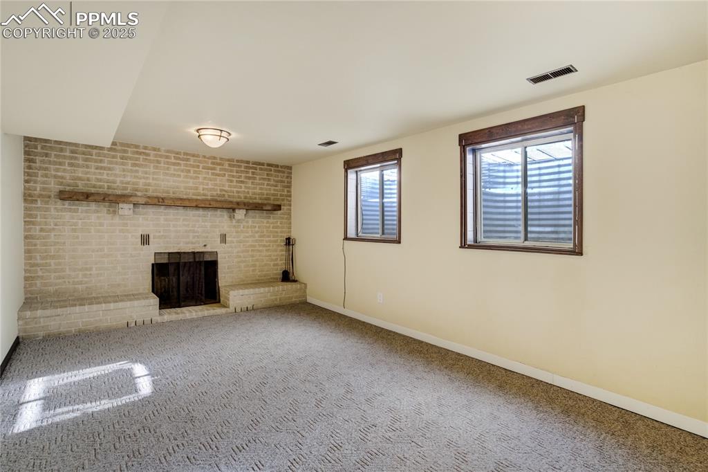Image 38 of 50: Bedroom includes closet and grand fireplace (Bed 6)