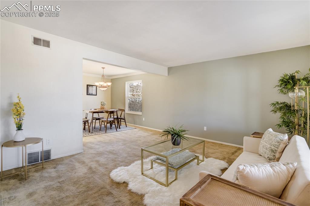 Image 5 of 50: View from entry (carpeted living room)