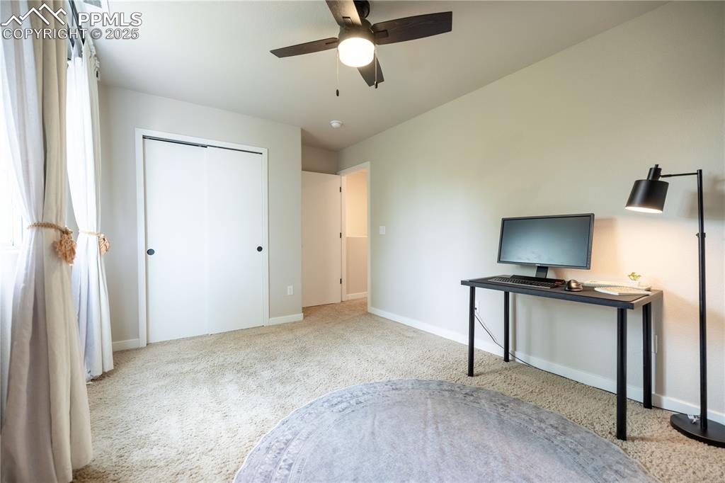 Image 20 of 42: Unfurnished bedroom featuring carpet flooring, a closet, and ceiling fan