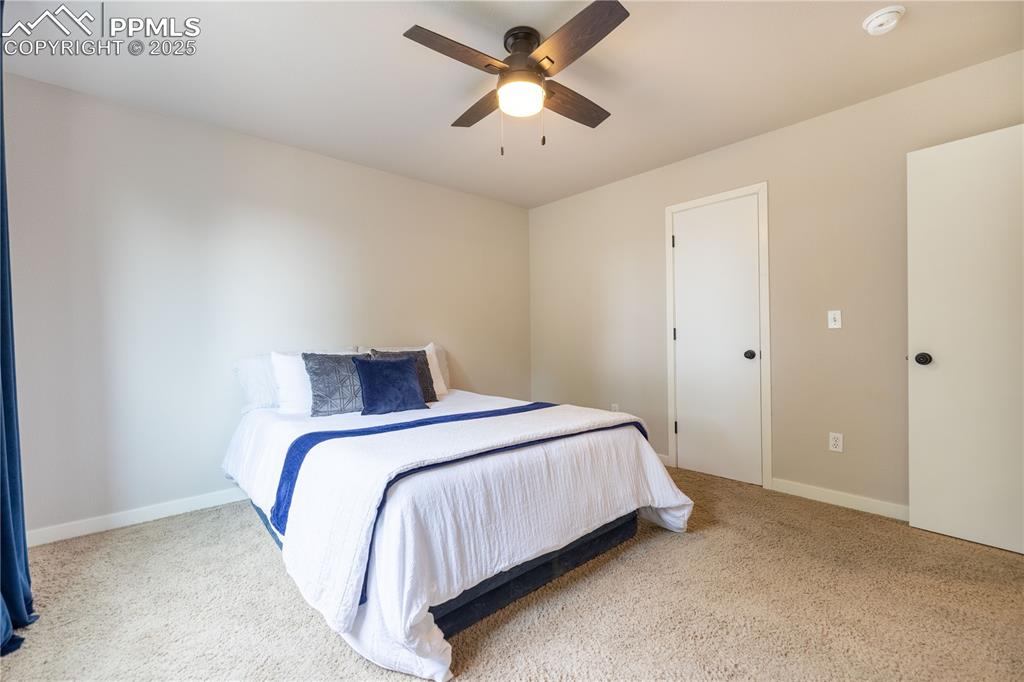 Image 23 of 42: Bedroom featuring carpet flooring and a ceiling fan