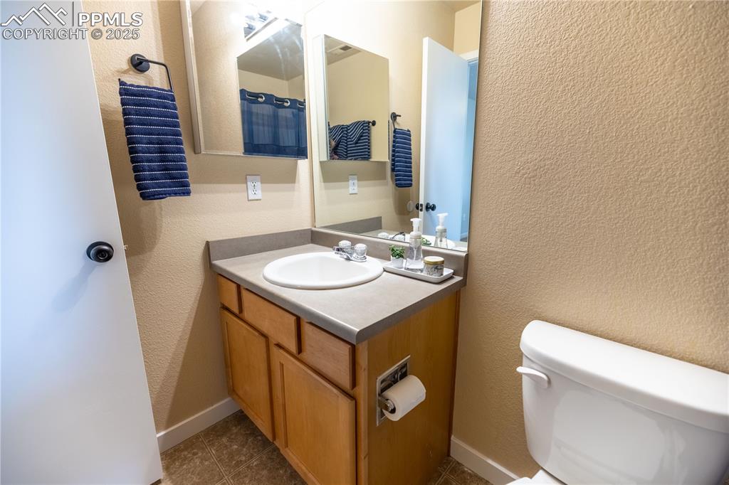 Image 25 of 42: Bathroom with vanity and tile patterned floors
