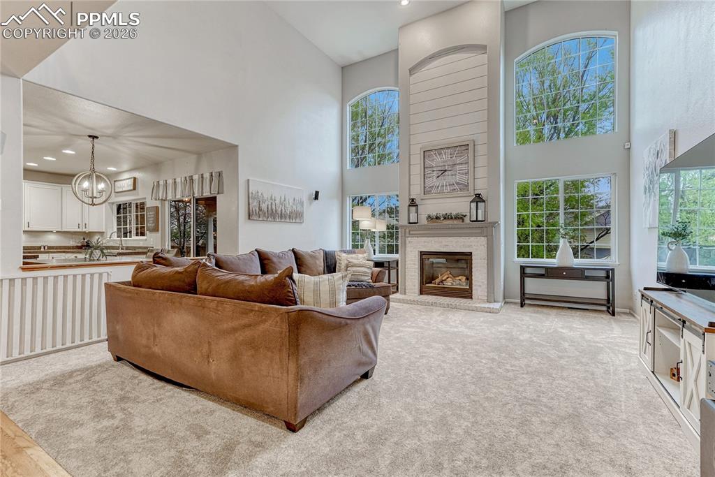 Image 11 of 48: A favorite gathering room wrapped in natural light