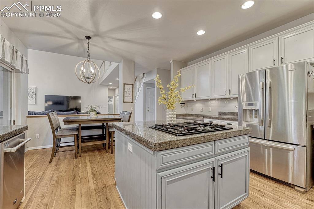 Image 17 of 48: Eat in dining space and open to the family room