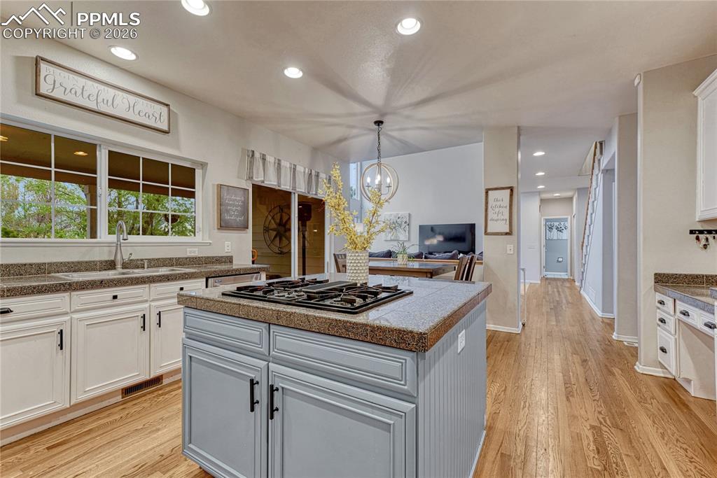 Image 19 of 48: Hardwood floors. Walkout to covered patio.