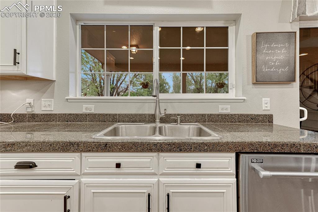 Image 20 of 48: Never feel blocked in at the kitchen sink.