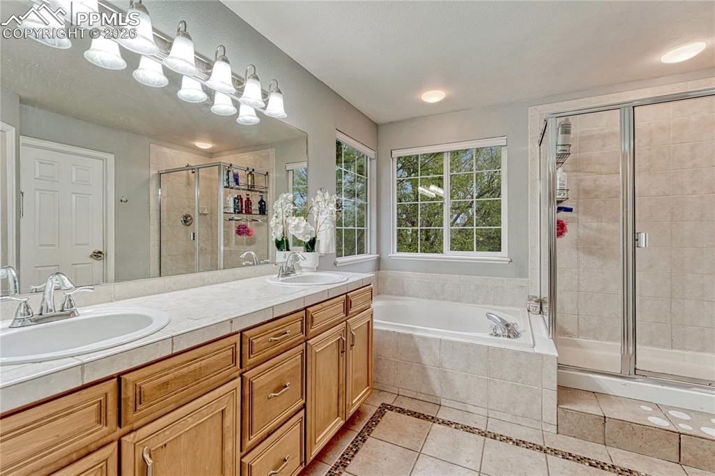 Image 28 of 48: Dual vanity and Walk-in Closet