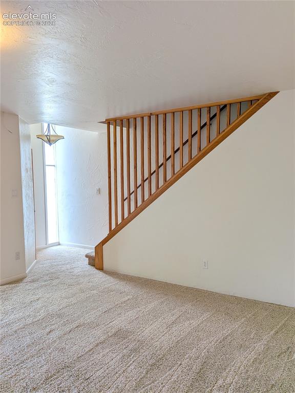 Image 3 of 36: Entry Closet and Stairs